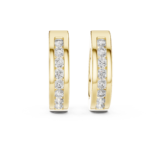 Front view of Modern Spark diamond huggie earrings in yellow gold.