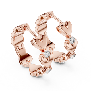 Side profile of rose gold romantic heart motif diamond hoop earrings.