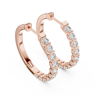 Side profile of rose gold classic round diamond huggie hoop earrings.