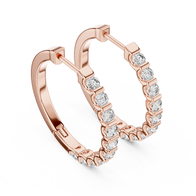 Side profile of rose gold classic round diamond huggie hoop earrings.