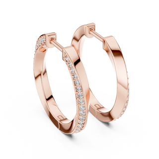 Side profile of rose gold classic round diamond huggie hoop earrings.