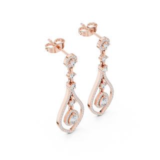 Side profile of rose gold pear-shaped diamond drop earrings.