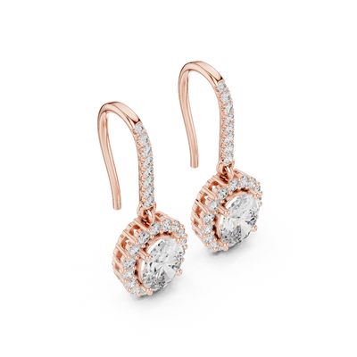 Side profile of rose gold emerald cut halo drop earrings