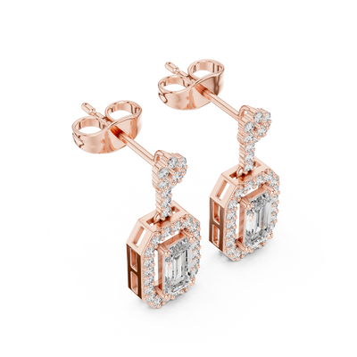 Side profile of rose gold emerald cut halo drop earrings.