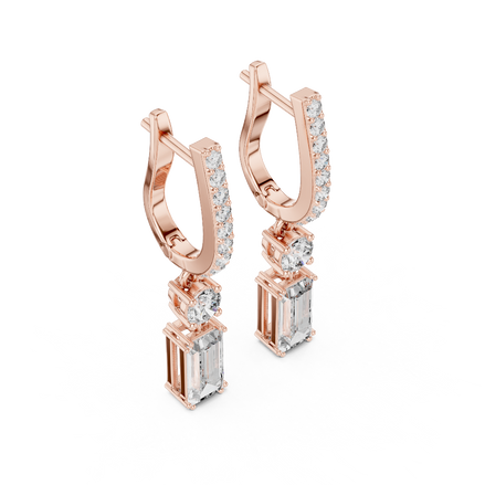 Side profile of rose gold emerald cut diamond drop earrings.