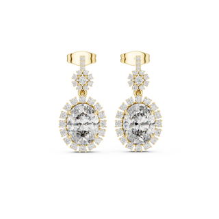 Front view of royal halo oval ruby drop earrings in yellow gold.