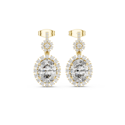 Front view of royal halo oval ruby drop earrings in yellow gold.
