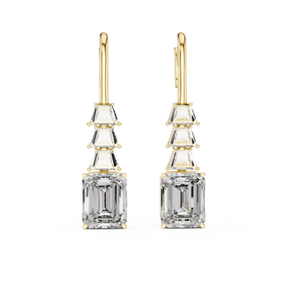 Front view of Elite Elegance emerald cut diamond drop earrings in yellow gold.