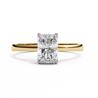 Front-facing view of a yellow gold radiant diamond four prong ring.