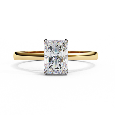 Front-facing view of a yellow gold radiant diamond four prong ring.