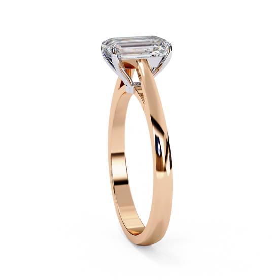 Side profile view of a rose gold radiant diamond four prong ring.