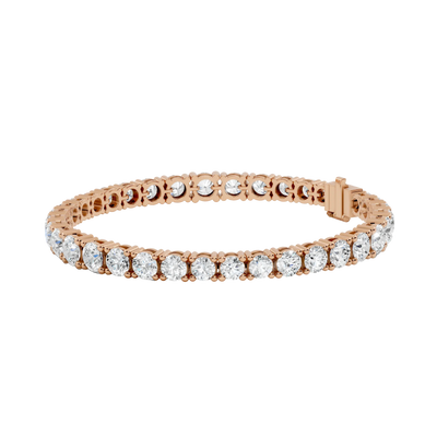 Rose gold bracelet with clear gemstones on a white background