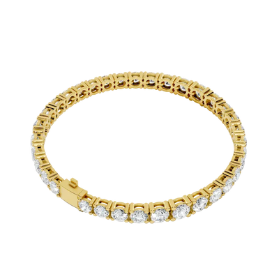 Gold bracelet with diamond accents on a white background