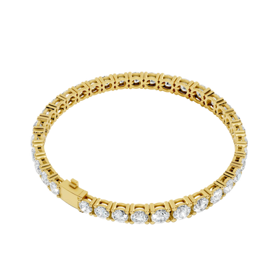 Gold bracelet with diamond accents on a white background