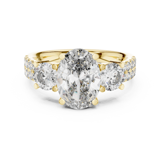oval diamond graduated side-stone ring in yellow gold
