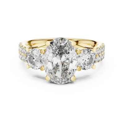 oval diamond graduated side-stone ring in yellow gold
