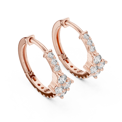 Side profile of rose gold floral motif diamond huggie hoop earrings.