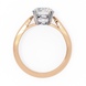 Rose gold ring with a diamond on a white background