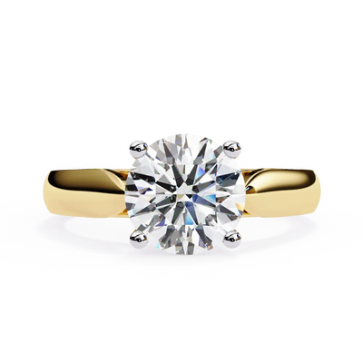 Gold ring with a large diamond on a white background