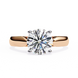 Rose gold ring with a large diamond on a white background