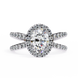 Diamond ring with a halo and side stones on a white background
