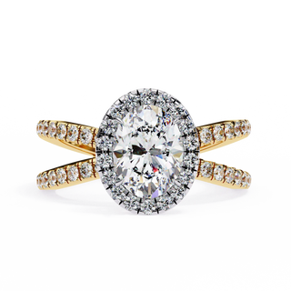 Gold and diamond ring on a white background