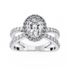 Diamond ring with a halo and intricate design on a white background