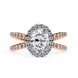 Diamond ring with rose gold band on a white background
