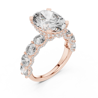 oval diamond round side-stone ring in rose gold
