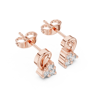 Side profile view of rose gold floral diamond studs