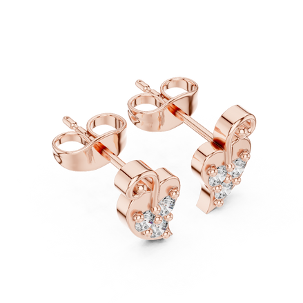 Side profile view of rose gold vine diamond studs 