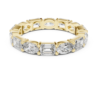emerald and oval lab grown diamond eternity ring in yellow gold
