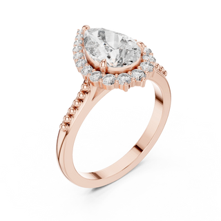 pear lab grown diamond graduated halo ring in rose gold