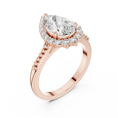 pear lab grown diamond graduated halo ring in rose gold