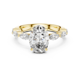 oval and marquise diamond engagement ring in yellow gold
