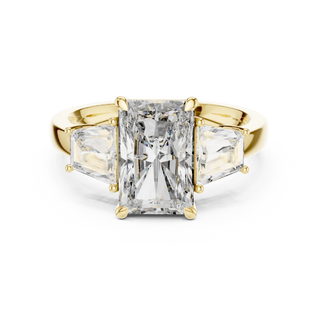 radiant and trapezoid diamond engagement ring in yellow gold
