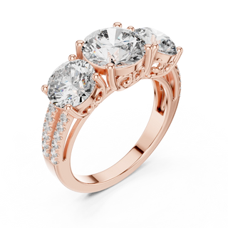 round scroll three-stone engagement ring in rose gold
