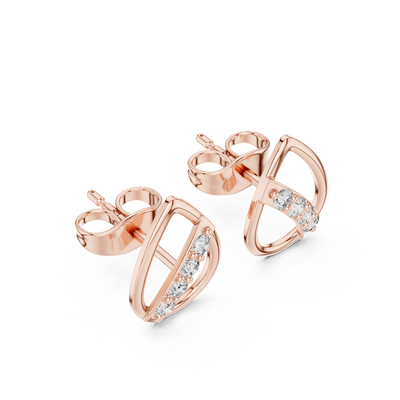 Side profile view of rose gold teardrop diamond studs 