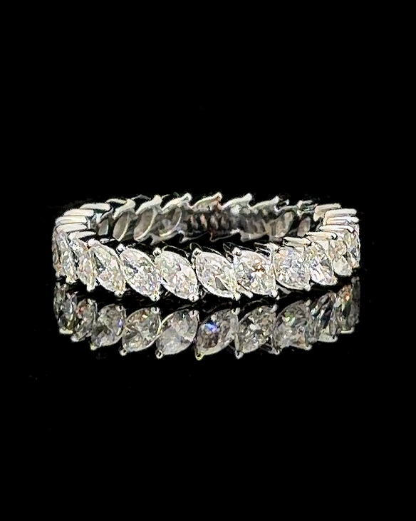 Main: White gold full eternity ring with 24 marquise lab grown diamonds on black
Detail: Close-up of marquise-cut lab grown diamonds arranged continuously around a white gold eternity ring
Side: Angled white gold eternity band showing pointed marquise lab grown diamonds around the full circumference