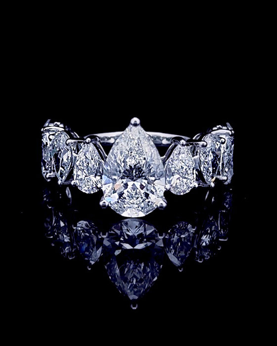 Main: White gold 2.00ct pear ring with eight graduated pear lab grown diamond sides on black
Detail: Close-up of 2.00ct pear lab grown diamond framed by graduated pear-cut side stones
Side: White gold nine-stone ring with pear lab grown diamonds cascading along both shoulders
