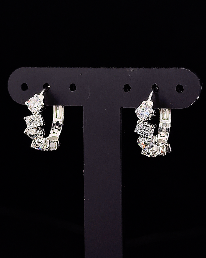 White gold hoop earrings with round, pear and emerald lab grown diamonds on black
