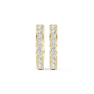 Front face of the yellow gold Radiant Line huggie earrings