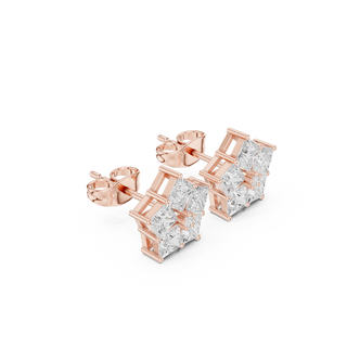 Side profile of rose gold star-shaped princess cut diamond studs.