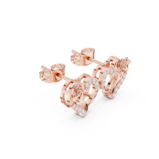 Side profile of rose gold romantic heart and rose diamond stud earrings.