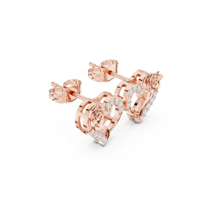 Side profile of rose gold romantic heart and rose diamond stud earrings.