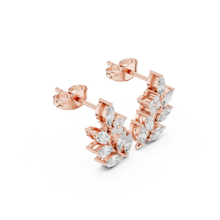 Side profile of rose gold botanical branch marquise diamond studs.