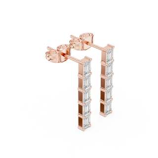 Side profile of rose gold vertical bar emerald-cut diamond studs.