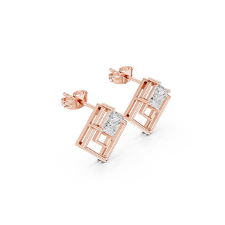 Side profile of rose gold geometric double-square open frame diamond studs.