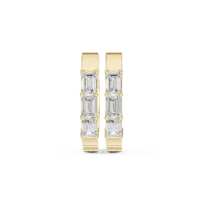Front view of Urban Edge emerald cut diamond huggie earrings in yellow gold.