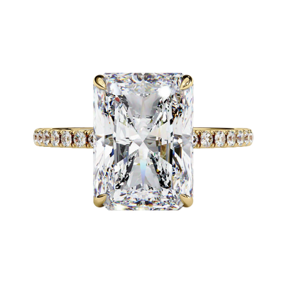 Front view of radiant cut diamond engagement ring in warm yellow gold.